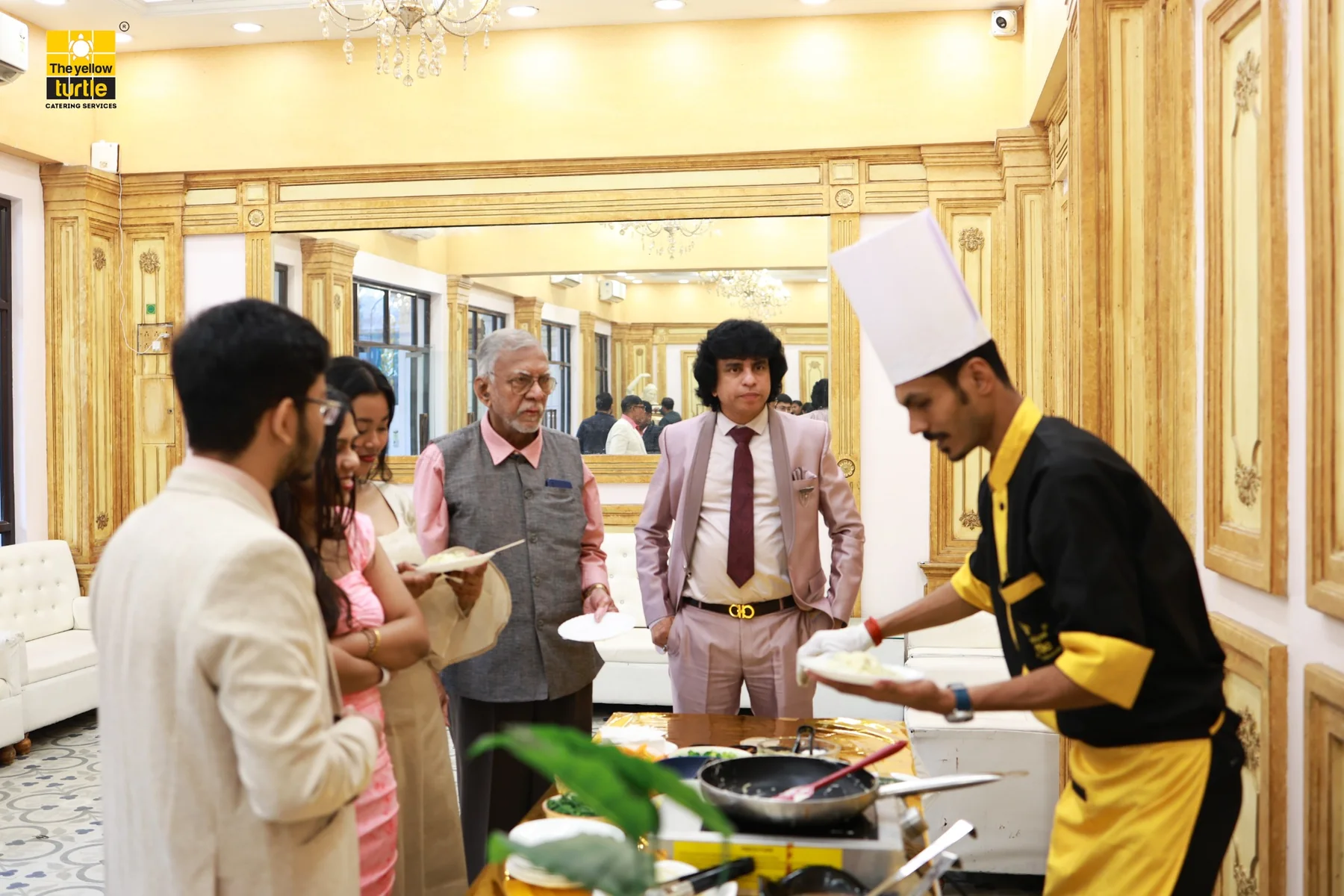 Guests enjoying a live catering station