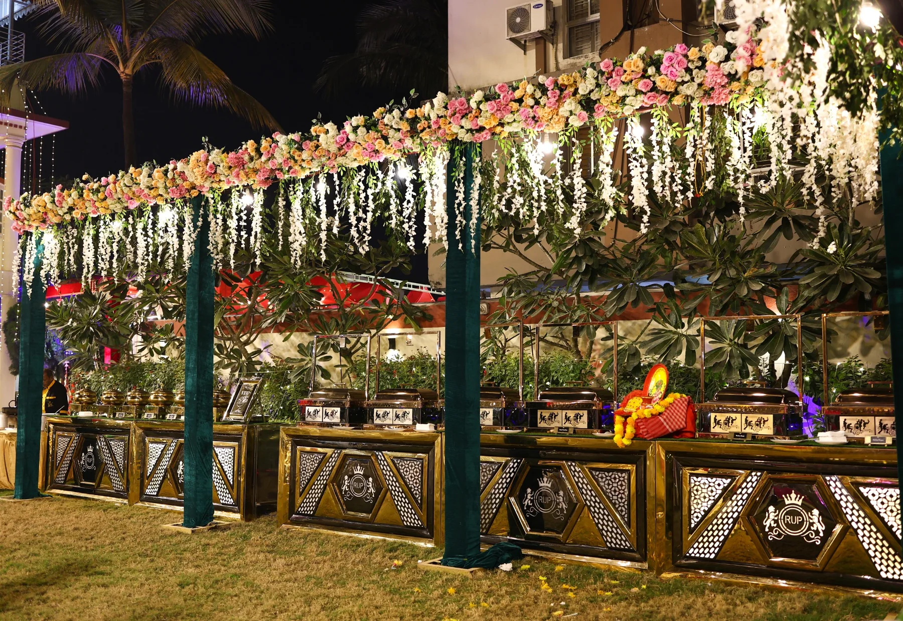 Large outdoor wedding buffet setup by The Yellow Turtle Catering
